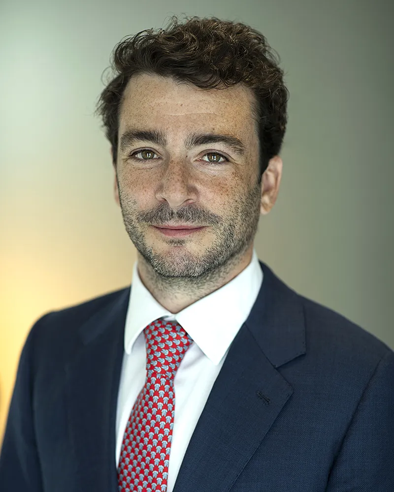 Professional corporate headshot of man in suit and tie in London