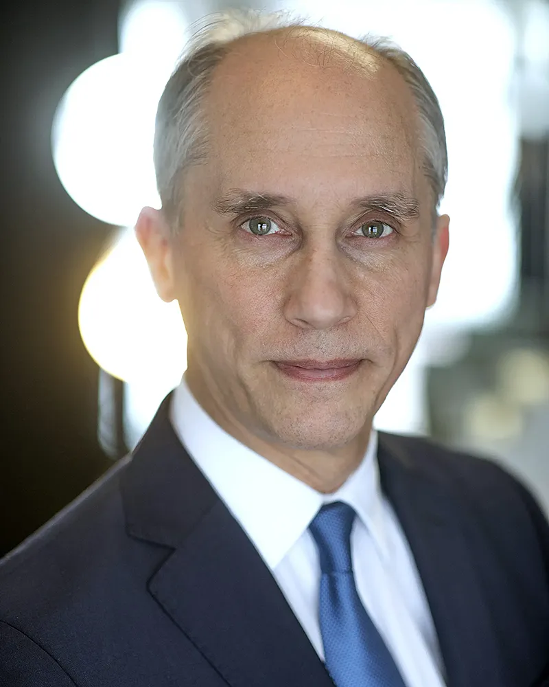 Professional corporate headshot of man in suit photographed in London