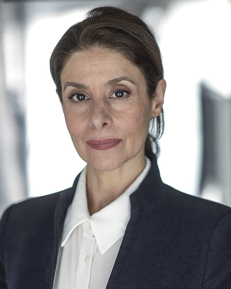 Natural corporate headshot of woman in business attire in London