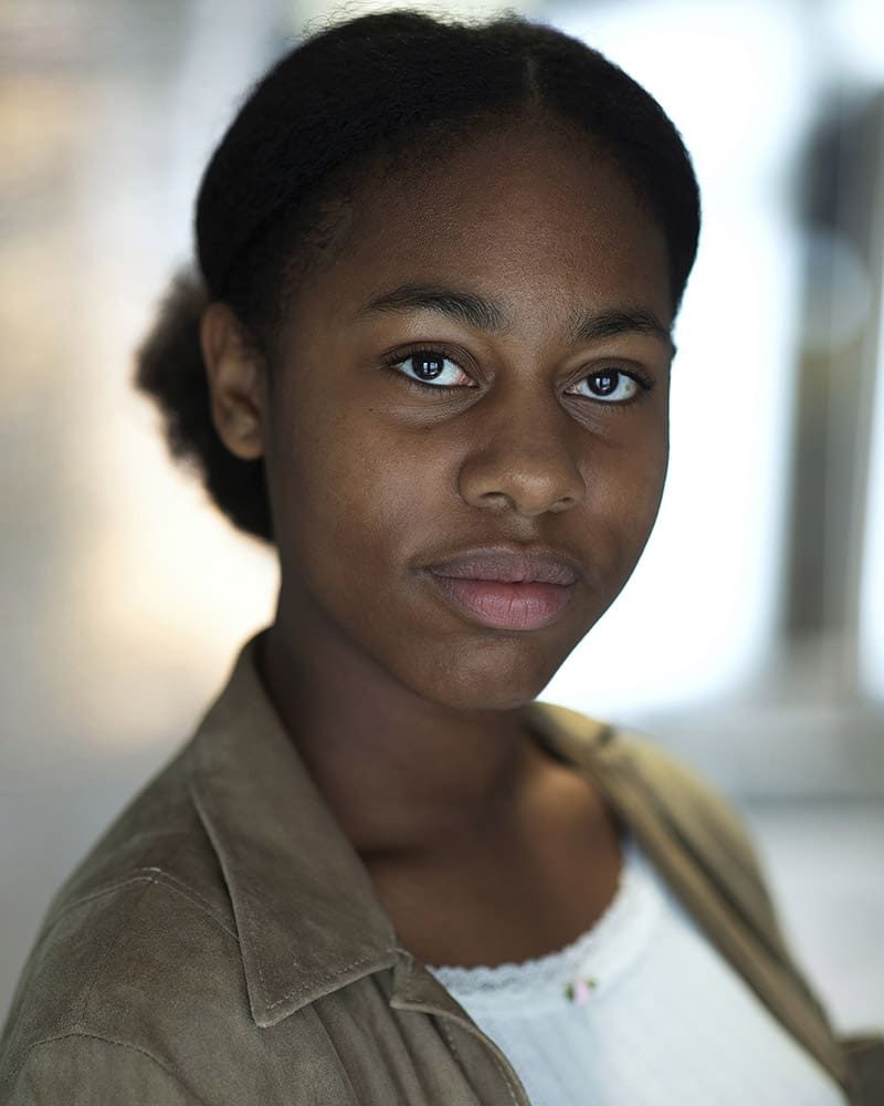 Neutral studio headshot of actress Uzoamaka Edozie taken by London headshot photographer Remy Hunter