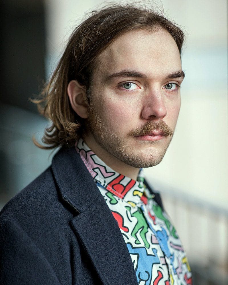 Outdoor natural light headshot of puppeteer Josh Macrow taken by headshot photographer Remy Hunter