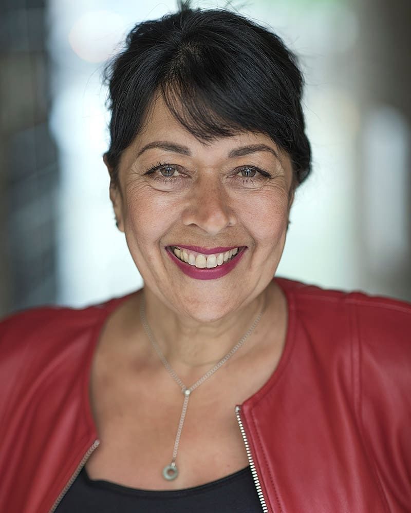 Smiley headshot of actress Shameem Ahmad taken by London headshot photographer Remy Hunter